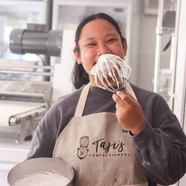 Global UGRAD Maria Regina Grace D. Katigbak baking at Taji's Confectionery.